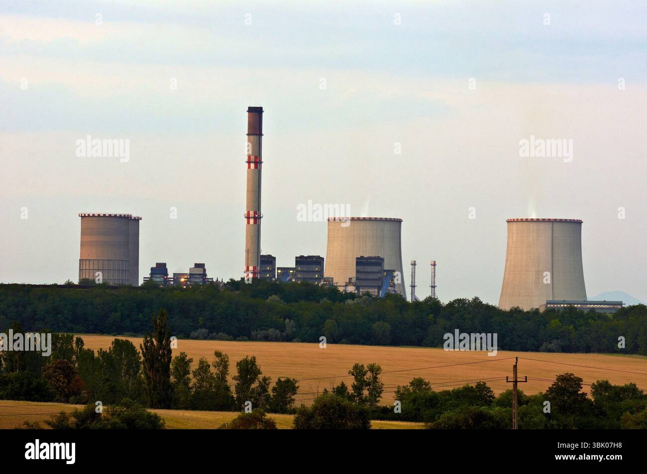 Nuclear power station at dusk with cooling towers Stock Photo - Alamy