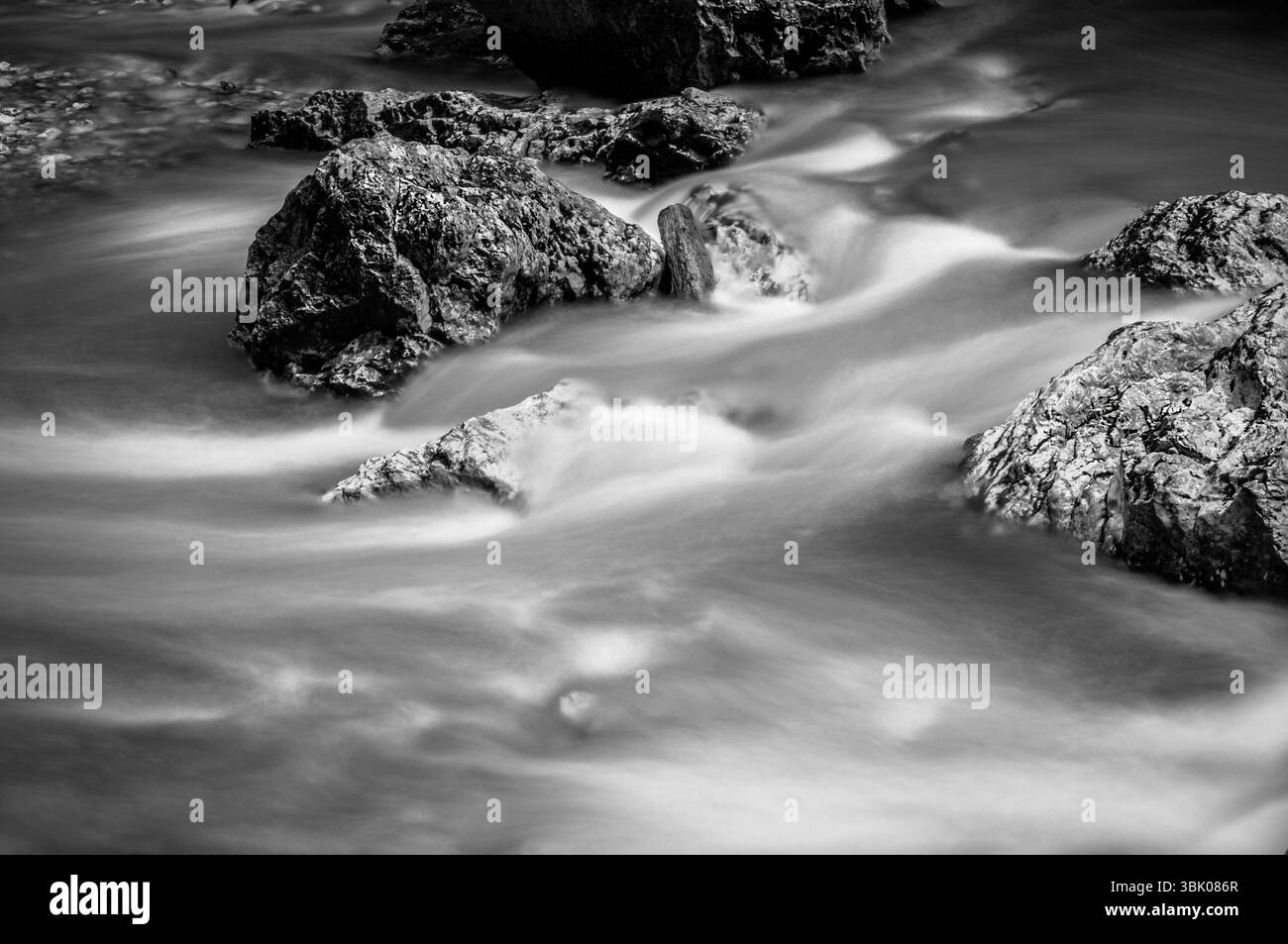 Long exposure photo of a Fast mountain river in black and white Stock Photo