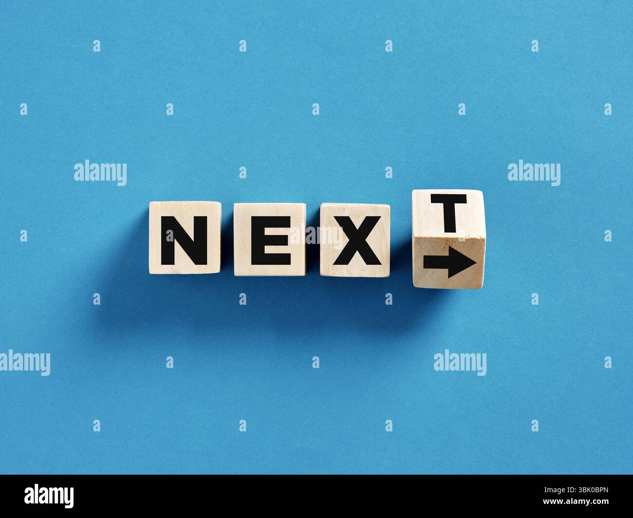 Next level or step in business or education. Four wooden cubes with the ...