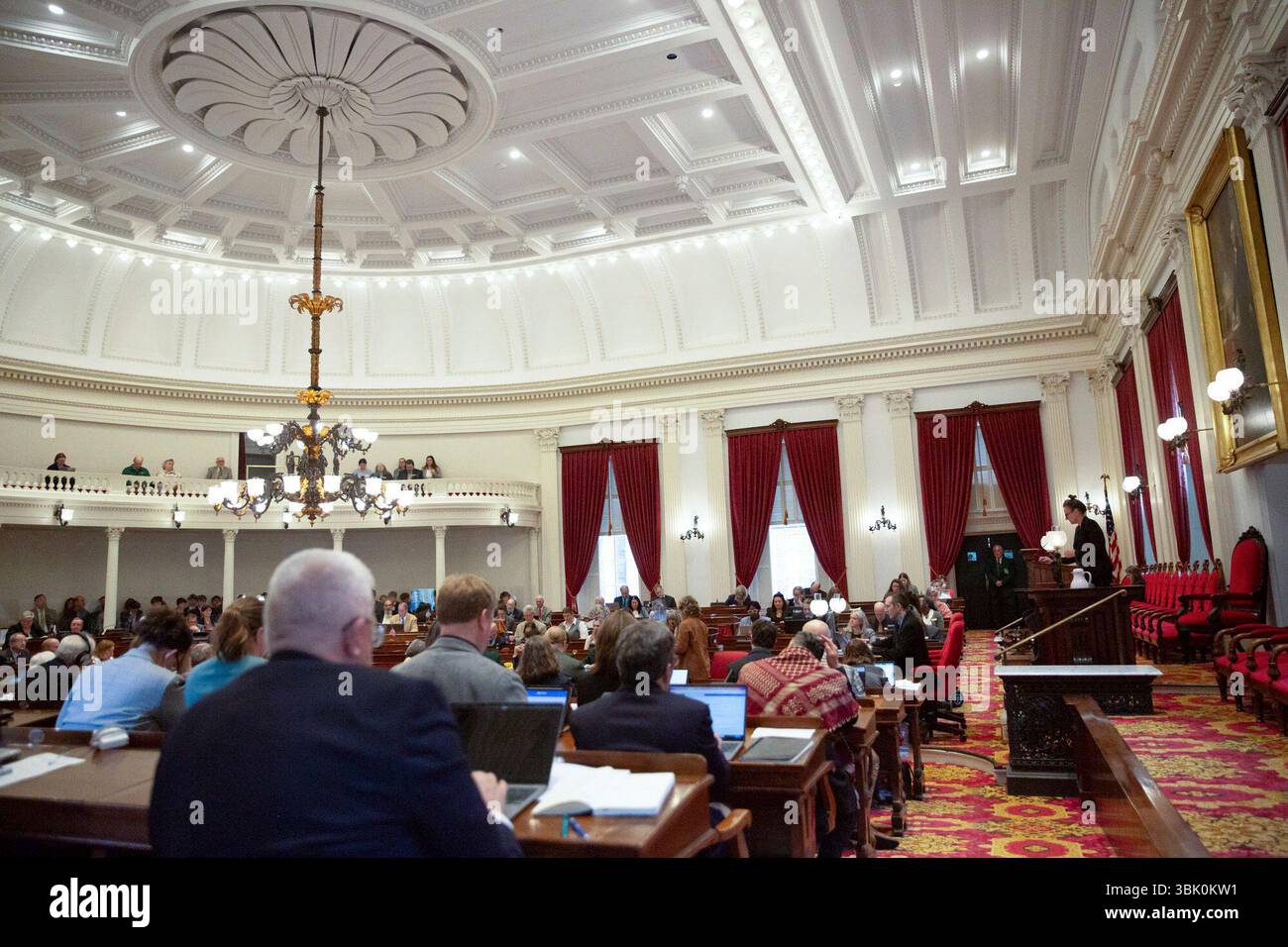 Vermont state legislators gather on the house floor at the Vermont ...