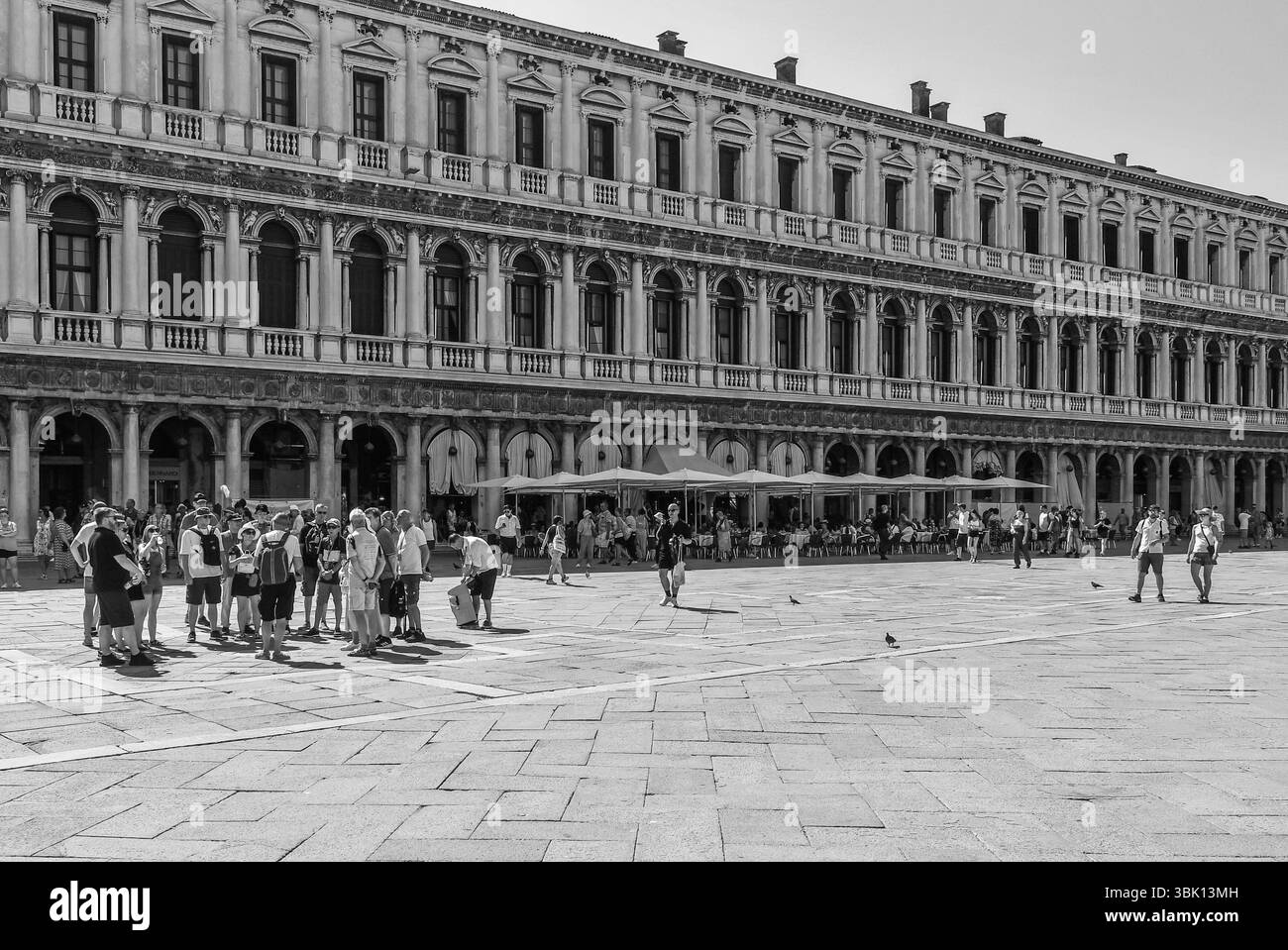 Monochrome. People at the famous Caffè Florian, established in 1720 in St Mark's Square, one of the oldest coffee house in the world, Venice, Italy Stock Photo