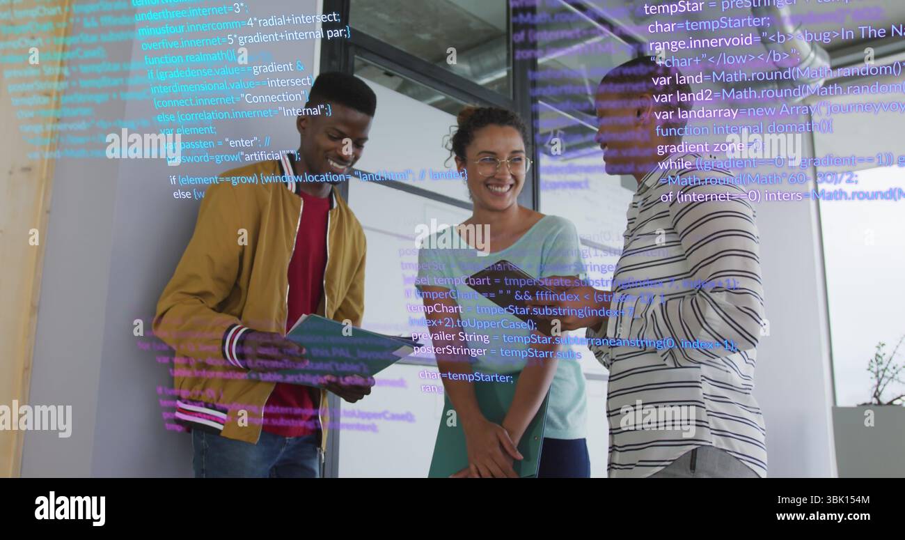 Standing three colleagues reviewing code on panel in office, with tablet, green folder and notebook Stock Photo