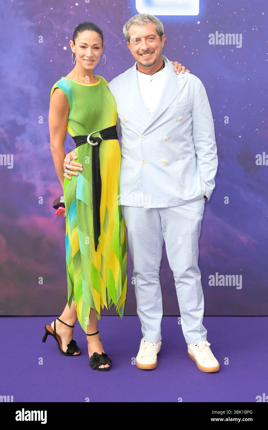 (L-R) Barbara Clara Pereira and Paolo Ruffini attend the blue carpet ...
