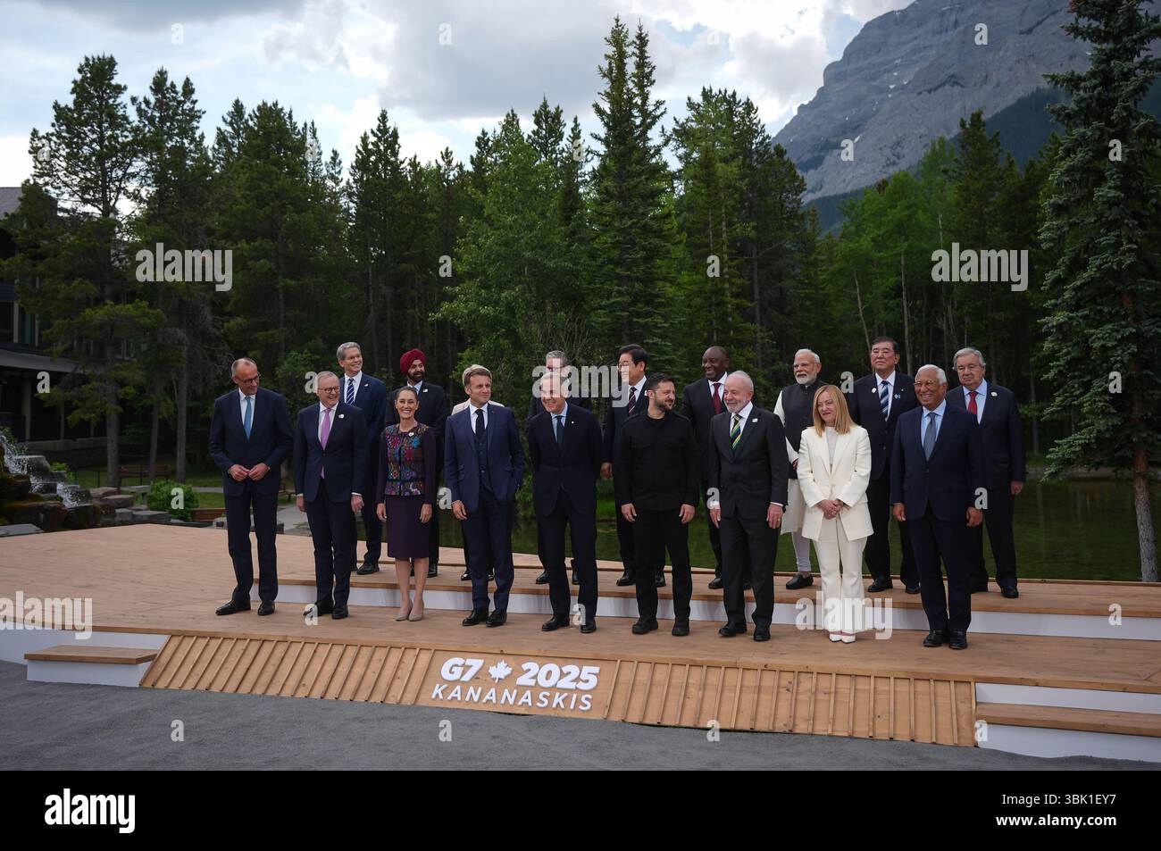 Canadian Prime Minister Mark Carney, front fifth left, stands for the family photo with world leaders and invited guests during the G7 Summit in Kananaskis, Alta., on Tuesday, June 17, 2025. Pictured in the front row from left to right; German Chancellor Friedrich Merz, Australian Prime Minister Anthony Albanese, Mexican President Claudia Sheinbaum, French President Emmanuel Macron, Canadian Prime Minister Mark Carney, Ukrainian President Volodymyr Zelensky, Brazilian President Luiz Inacio Lula da Silva, Italian Prime Minister Giorgia Meloni and European Council President Antonio Costa. Pictur Stock Photo