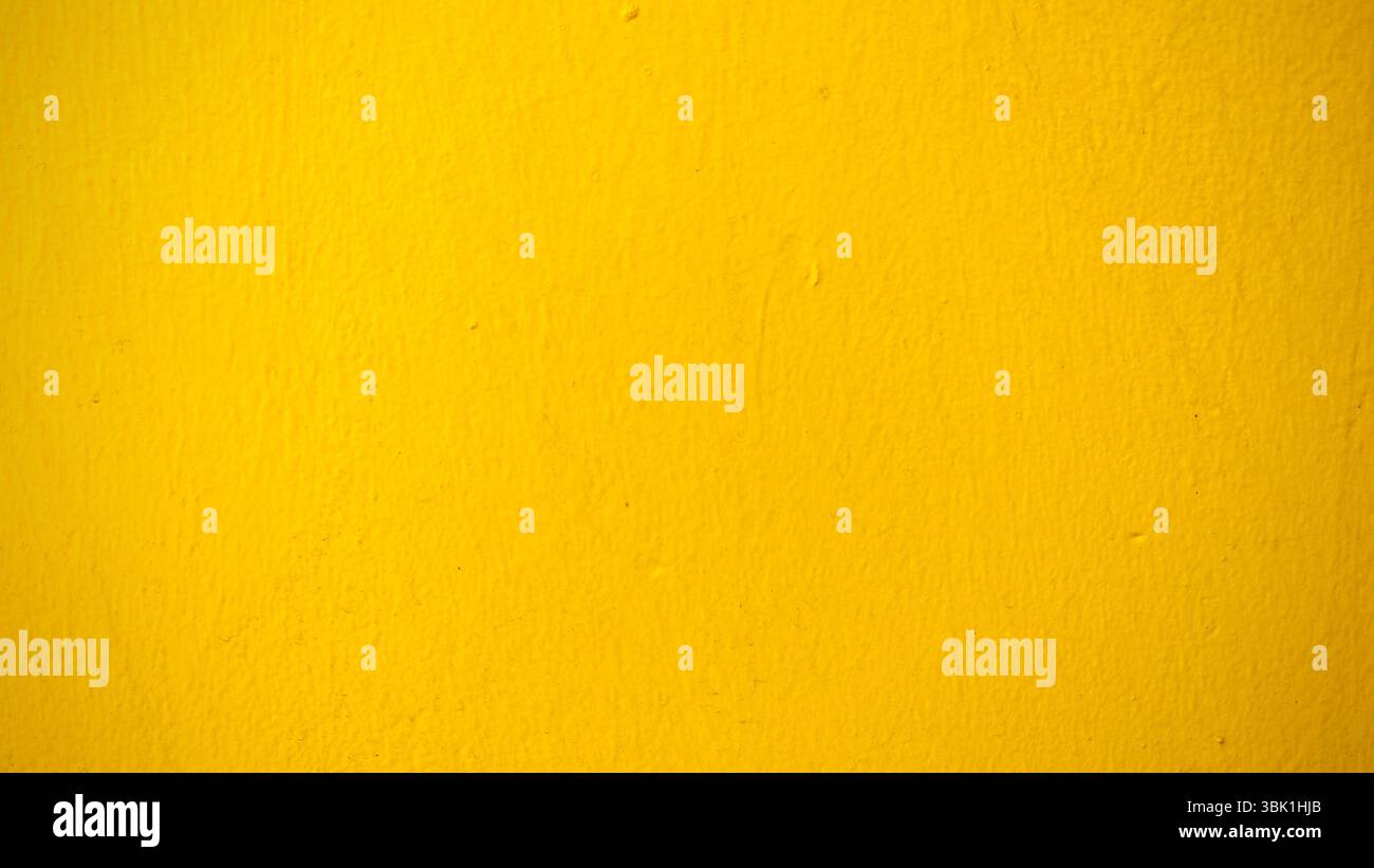 Vibrant Yellow Wall Texture Background Stock Photo