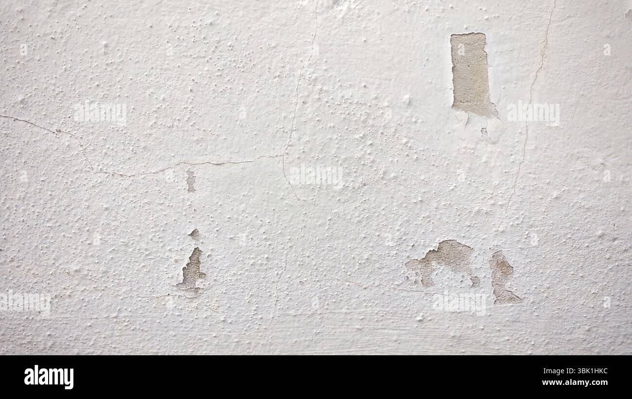 Damaged White Wall Texture with Peeling Paint and Cracks Stock Photo