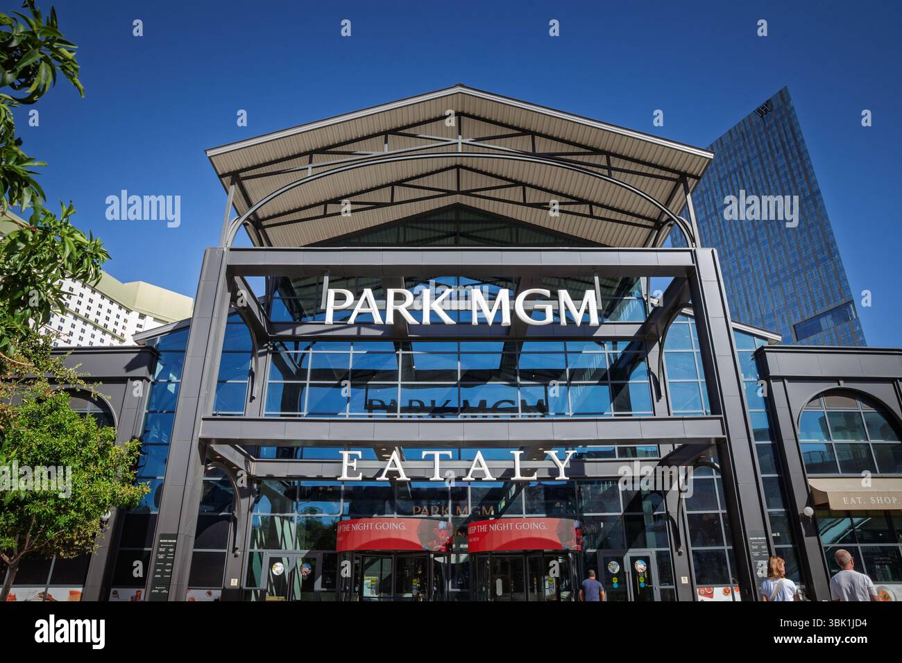 LAS VEGAS, AUGUST 21, 2024: Park MGM Las Vegas entrance with a sunlit glass atrium and bold white lettering with eataly las vegas logo. Park MGM is a Stock Photo