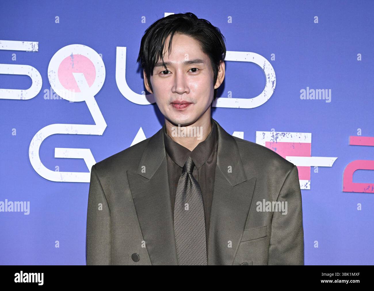 Park Sung-hoon poses at a Netflix "Squid Game" cast photo call at the