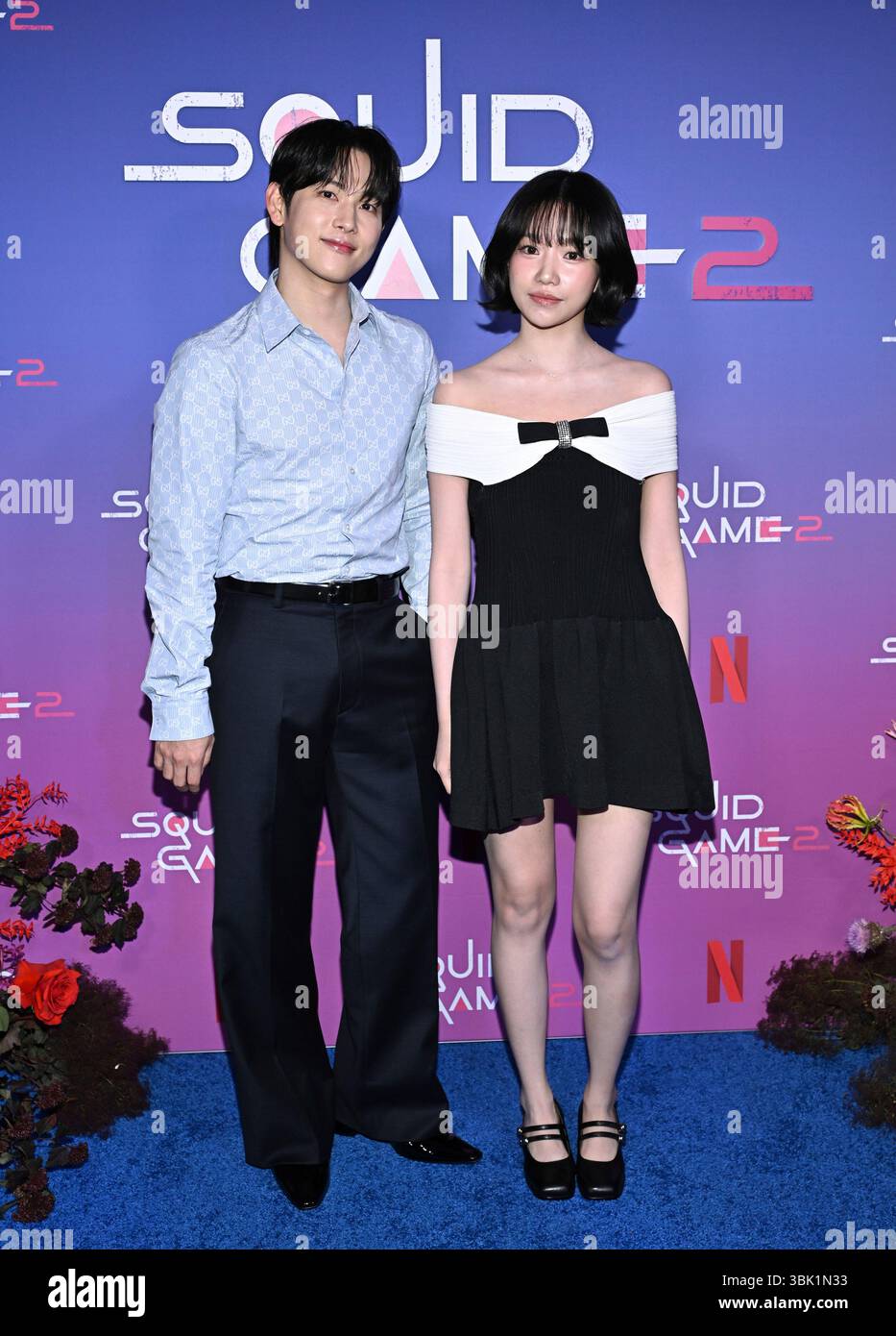 Yim Si-wan, left, and Jo Yu-ri pose together at a Netflix "Squid Game