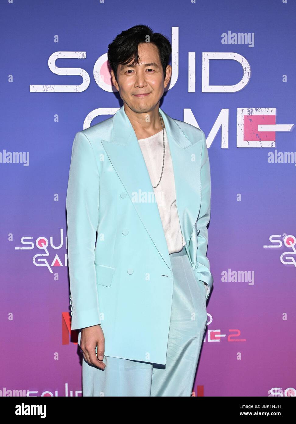 Lee Jung-jae poses at a Netflix "Squid Game" cast photo call at the