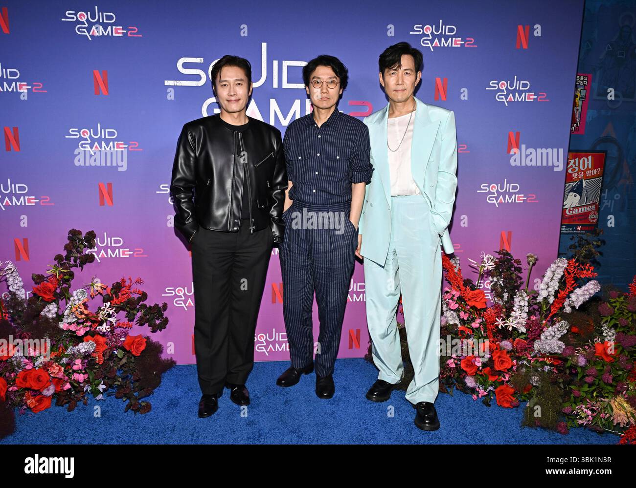Lee Byung-hun, left, Hwang Dong-hyuk, Lee Jung-jae participate in a