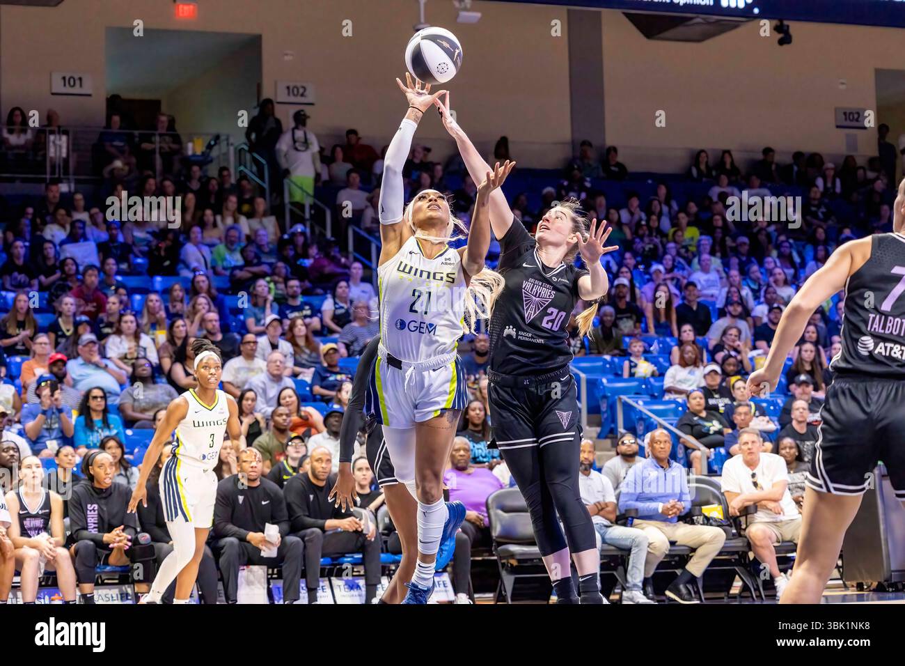 Arlington, Texas, USA. 17th June, 2025. Dallas Wings guard DIJONAI CARRINGTON (21) gets fouled while going for a layup by Golden State Valkyries guard KATE MARTIN (20) during a WNBA game between the Golden State Valkyries and Dallas Wings at College Park Center. Dallas wins 80-71. (Credit Image: © Mark Fann/ZUMA Press Wire) EDITORIAL USAGE ONLY! Not for Commercial USAGE! Stock Photo