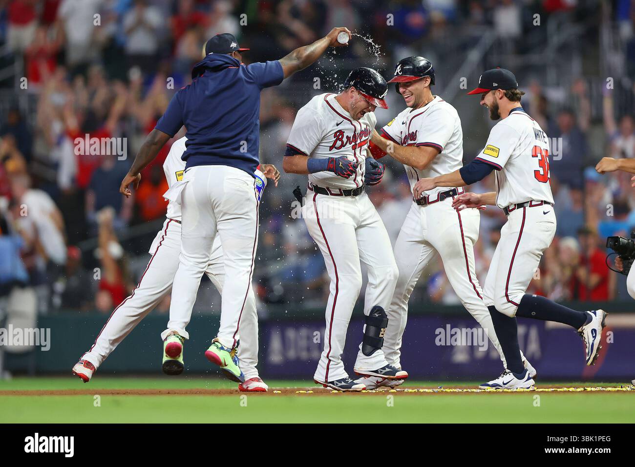 ATLANTA, GA - JUNE 17: Austin Riley #27 of the Atlanta Braves gets a ...