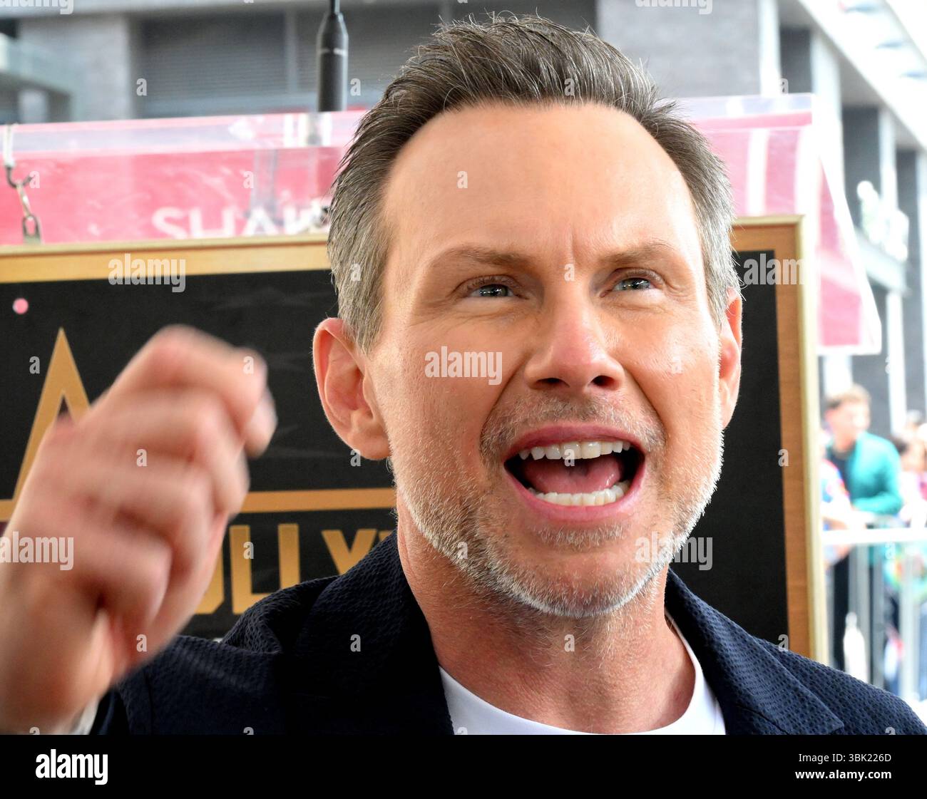 Christian Slater does interviews on his Star during the Ceremony On The
