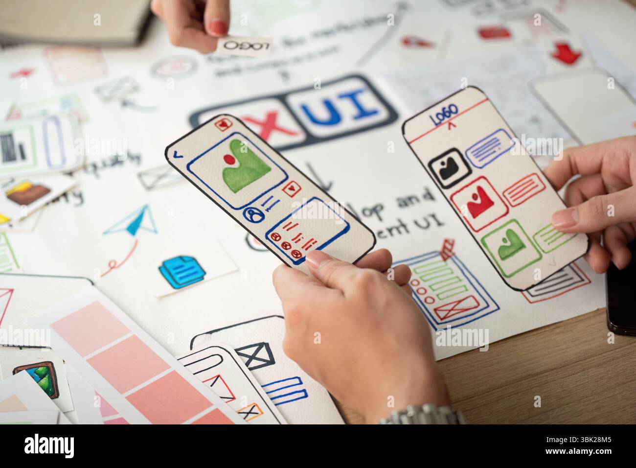 Designers Discussing User Interface Prototypes and Feedback Stock Photo