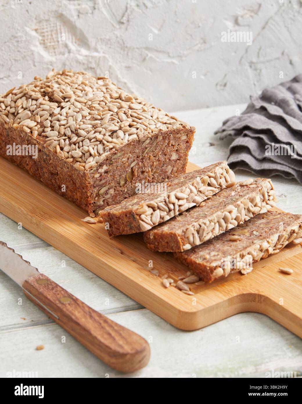 Rustic rye bread on a wooden board – traditional whole grain loaf, perfect for breakfast, food styling, baking scenes Stock Photo