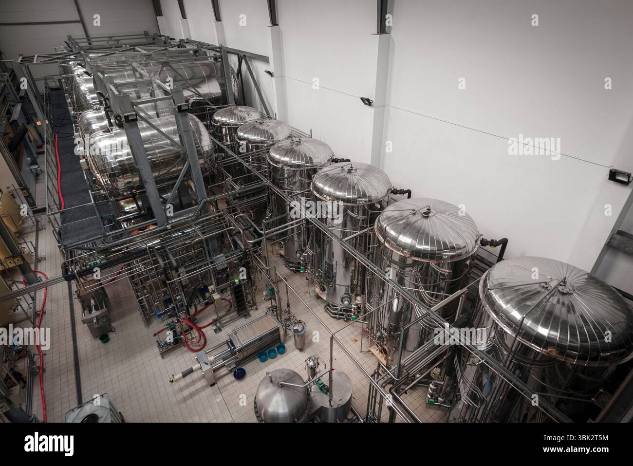 Industrial interior of an alcohol factory with silos Stock Photo - Alamy