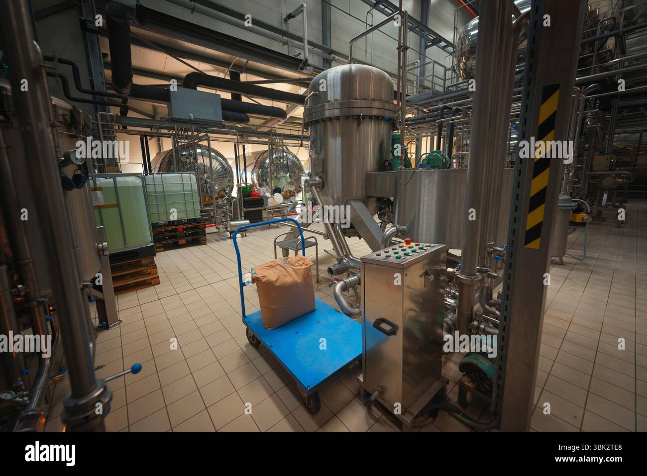 Industrial interior of an alcohol factory with silos Stock Photo - Alamy