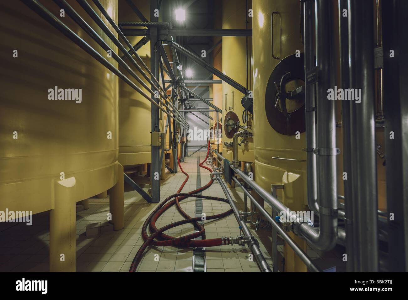 Industrial interior with welded silos angle shot Stock Photo - Alamy