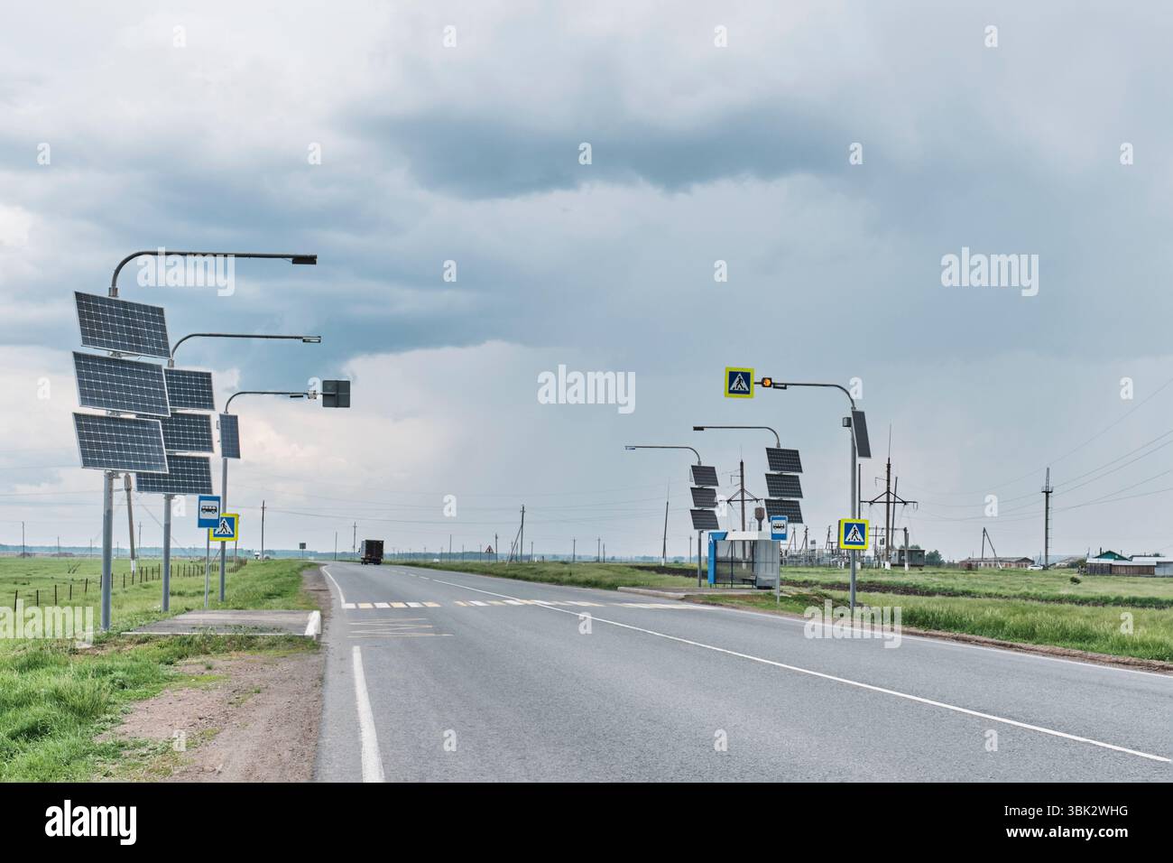 Empty countryside road with pedestrian crossings and bus stops equipped ...