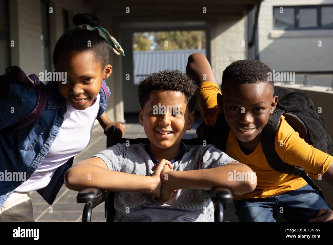 Happy diverse students with backpacks smiling together at school ...