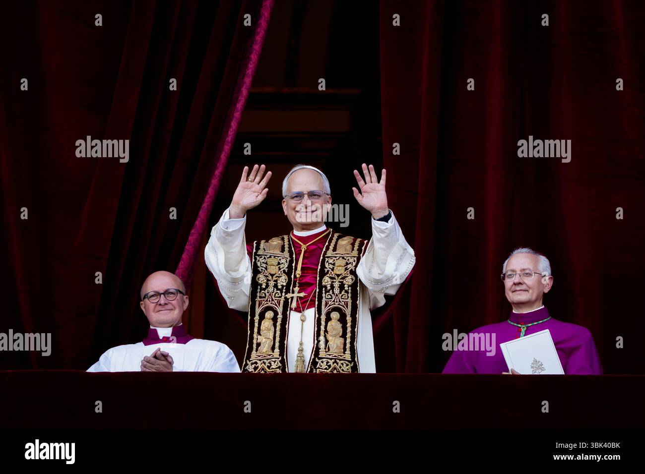 Newly elected Pope Leo XIV, Robert Prevost arrives on the main central loggia balcony of the St Peter's Basilica for the first time, after the cardina Stock Photo