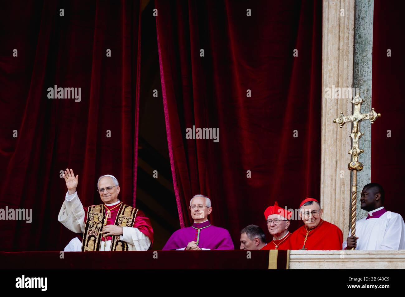 Newly elected Pope Leo XIV, Robert Prevost arrives on the main central loggia balcony of the St Peter's Basilica for the first time, after the cardina Stock Photo