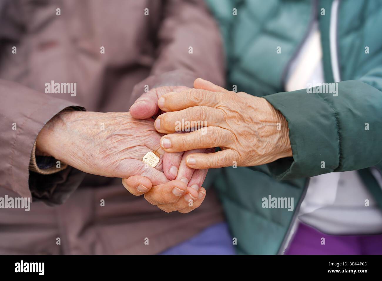 Elderly Couple Holding Hands with Arthritis Stock Photo