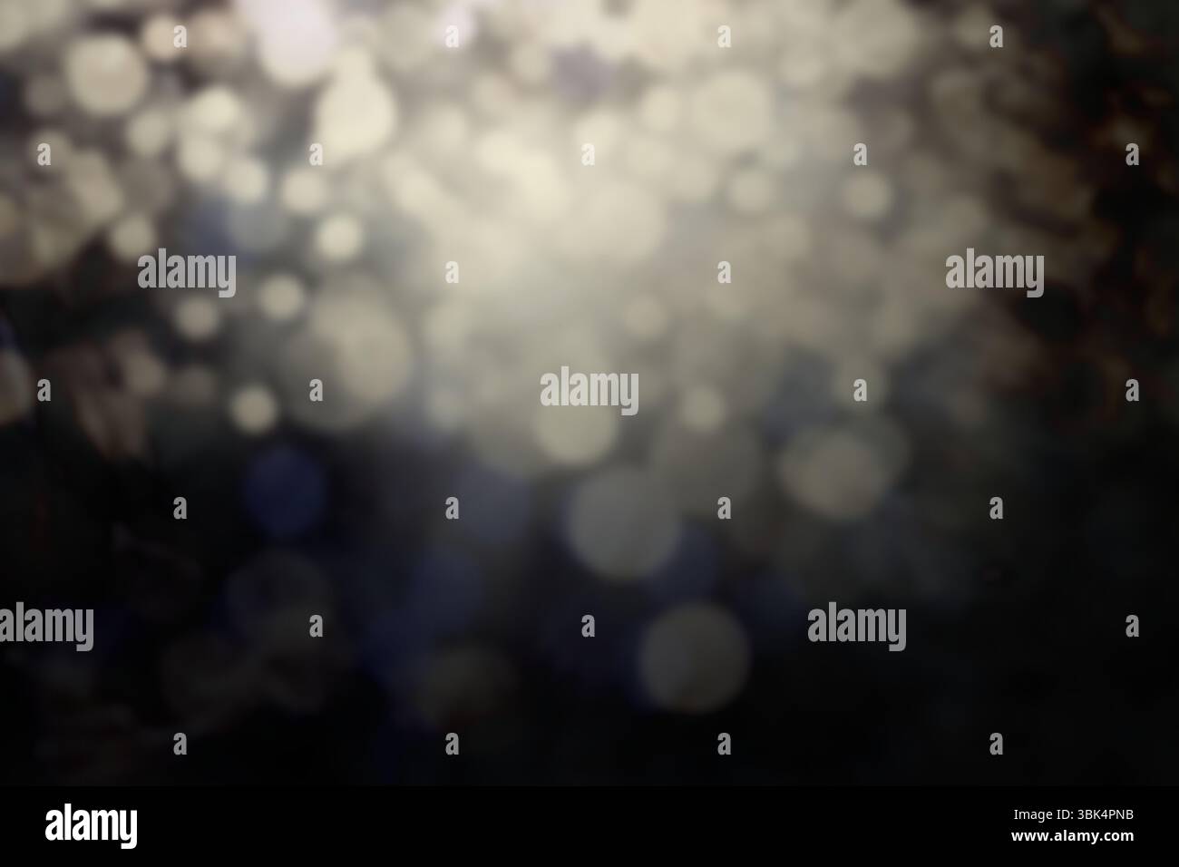 Abstract circular light spots are floating over dark blurred background, flat design Stock Photo
