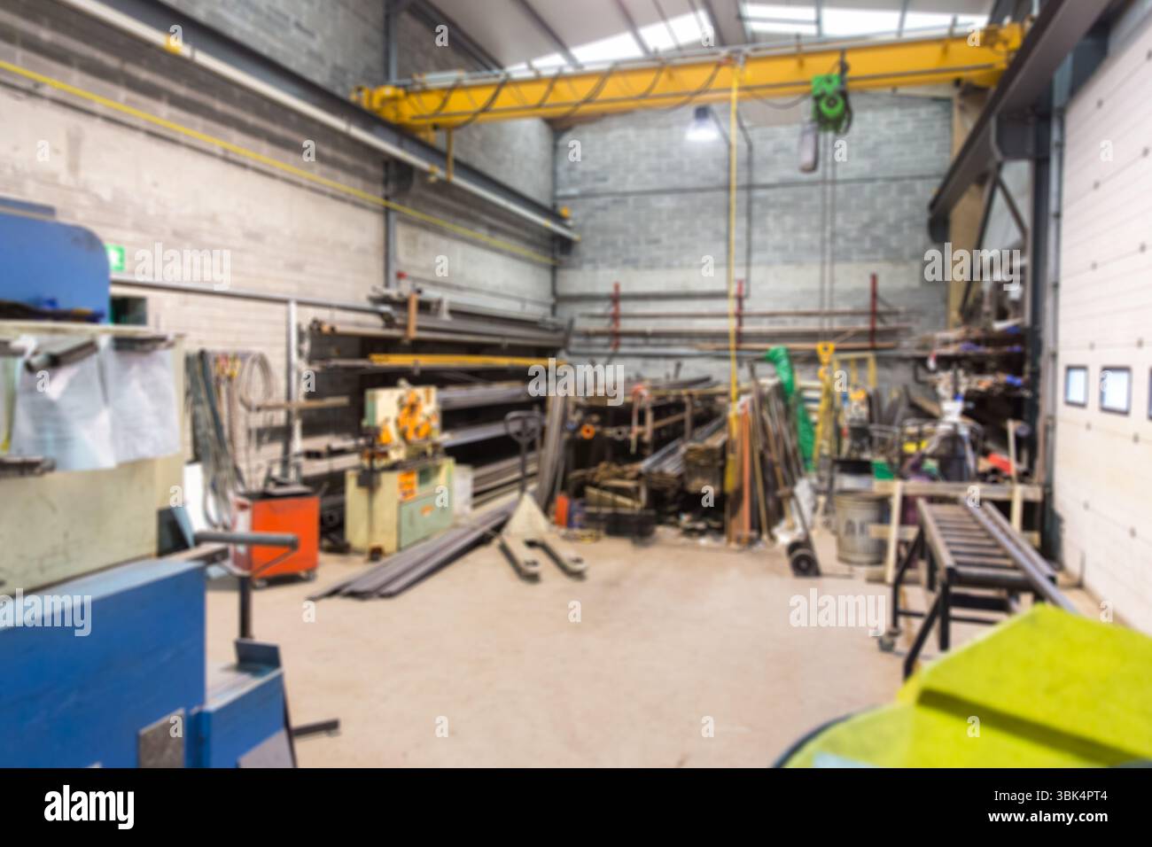 Metal fabrication workshop is being shown in flat design, featuring yellow gantry crane, copy space Stock Photo