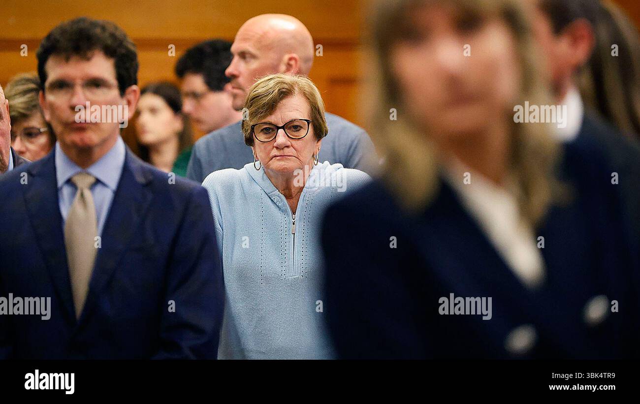 Peggy O'Keefe, mother of John O'Keefe watches as the jury