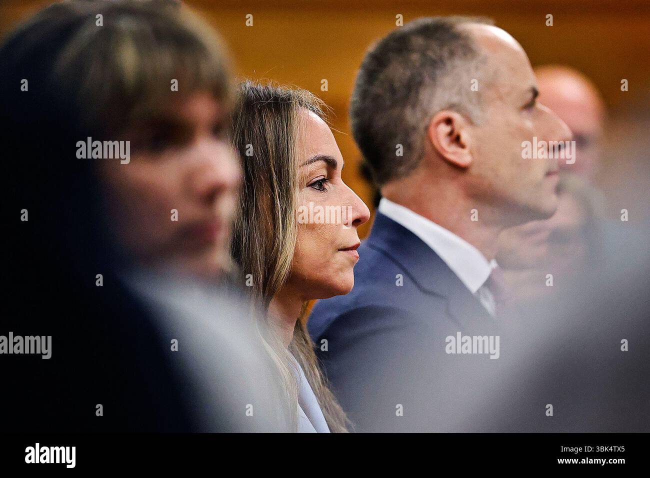 Karen Read and her defense team listen to Judge Beverly Cannone as she ...