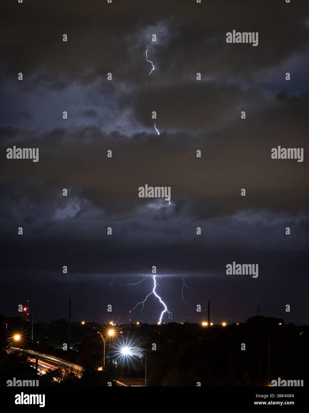 Lightning Strikes at night in a Tropical Storm Stock Photo - Alamy
