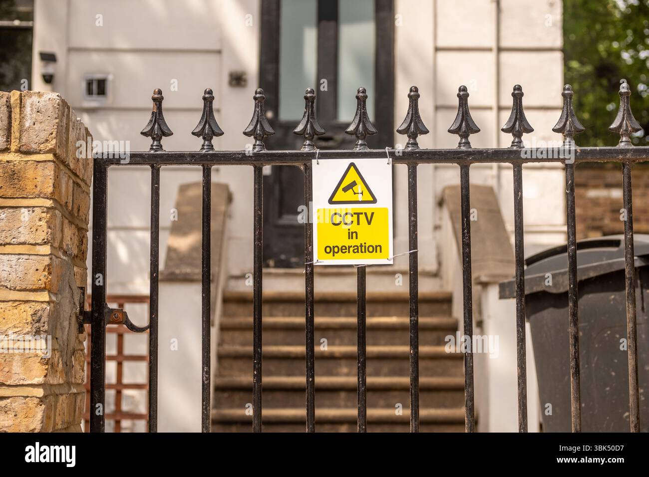 LONDON- MAY 20, 2025: CCTV in operation sign on gate of central London house Stock Photo