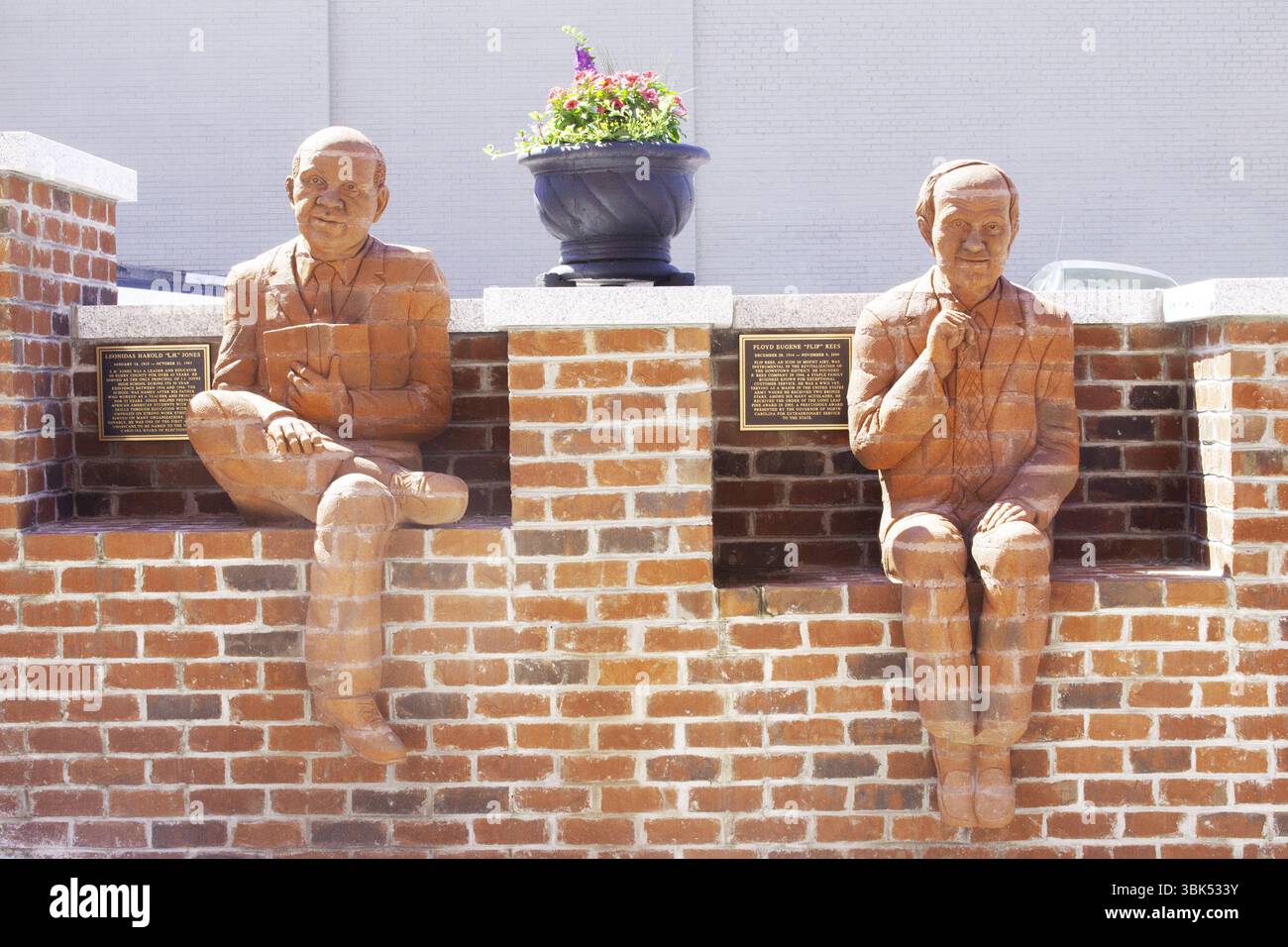Brick figures carved to honor local whittlers on the Whittling Wall in Andy Griffith’s hometown of Mount Airy, North Carolina. Stock Photo