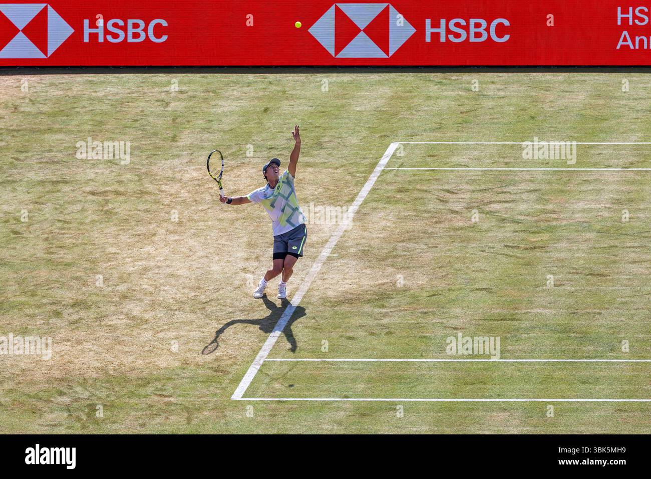 17th June 2025; HSBC Championships, Queens Club, West Kensington, London, England: HSBC Mens Championships Queens Club, Day 2; Adam Walton (AUS) serves against Carlos Alcaraz (ESP) Credit: Action Plus Sports Images/Alamy Live News Stock Photo