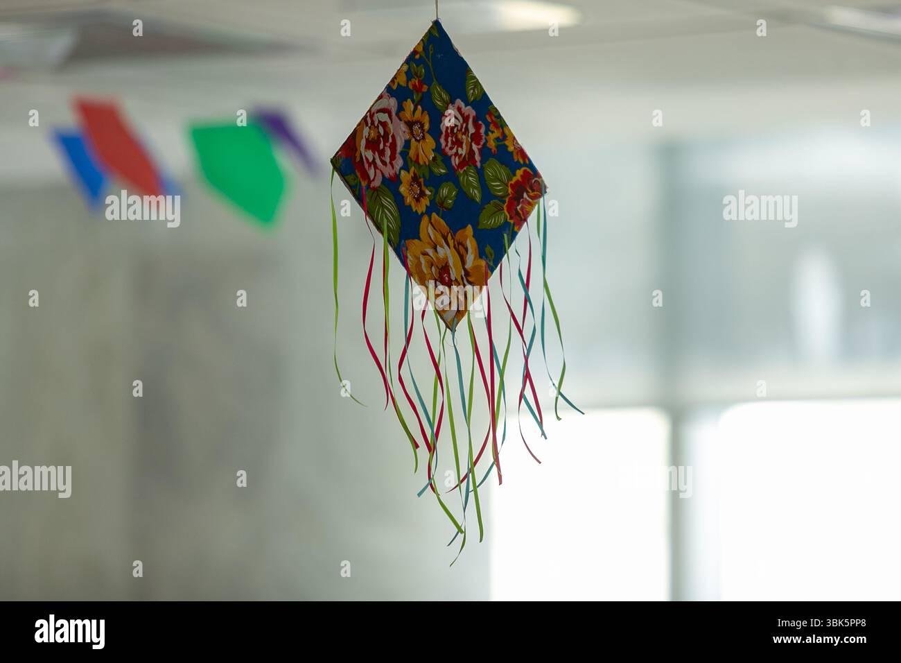 Decorations with June motifs hanging from the ceiling. These ...