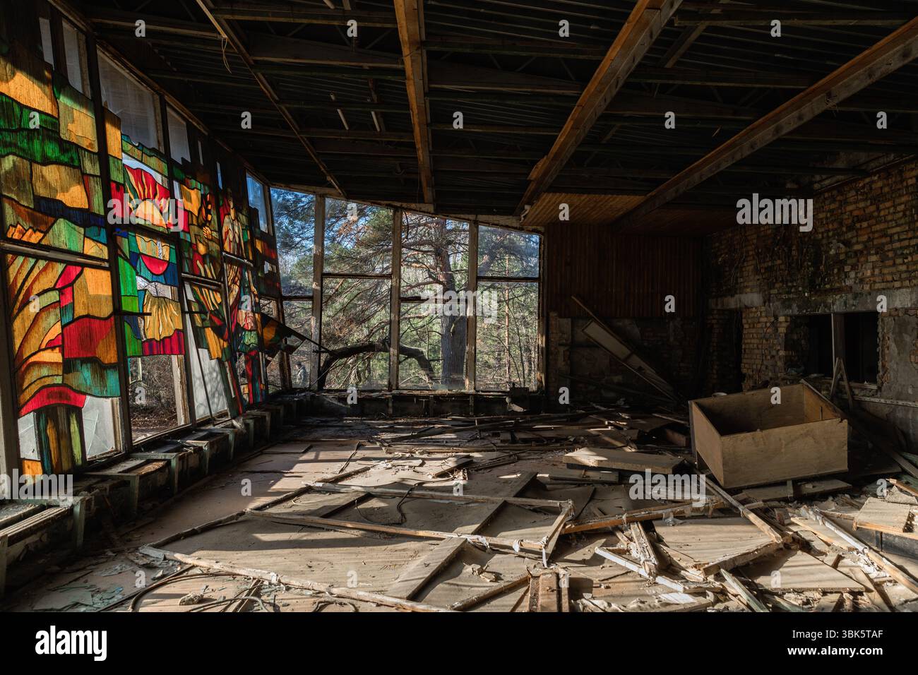 Large broken windows of abandoned building angle shot Stock Photo - Alamy