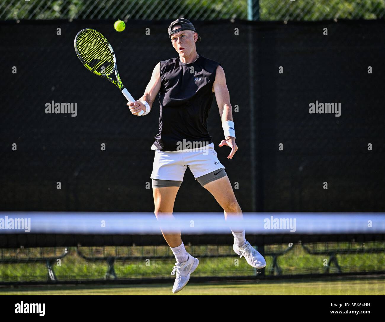 18th June 2025; Lexus Nottingham Tennis Centre, Nottingham, England; Lexus Nottingham Open, Day 3; Cleeve Harper (CAN) volleys the ball in the second round match with his partner Eliot Spizzirri (USA) against Santiago Gonzalez (MEX) and Austin Krajicec (USA) Credit: Action Plus Sports Images/Alamy Live News Stock Photo