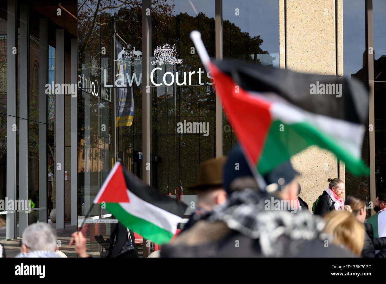 A big crowd gathers outside NSW Supreme Court in Sydney, Thursday, June ...