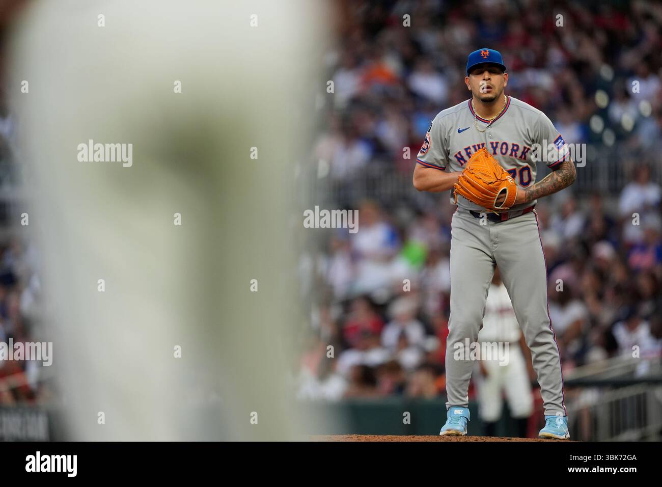 New York Mets pitcher José Buttó (70) works from the mound in the fifth ...