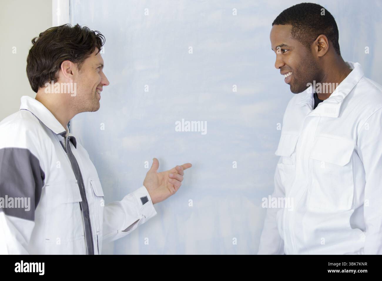 house painters laughing about something Stock Photo