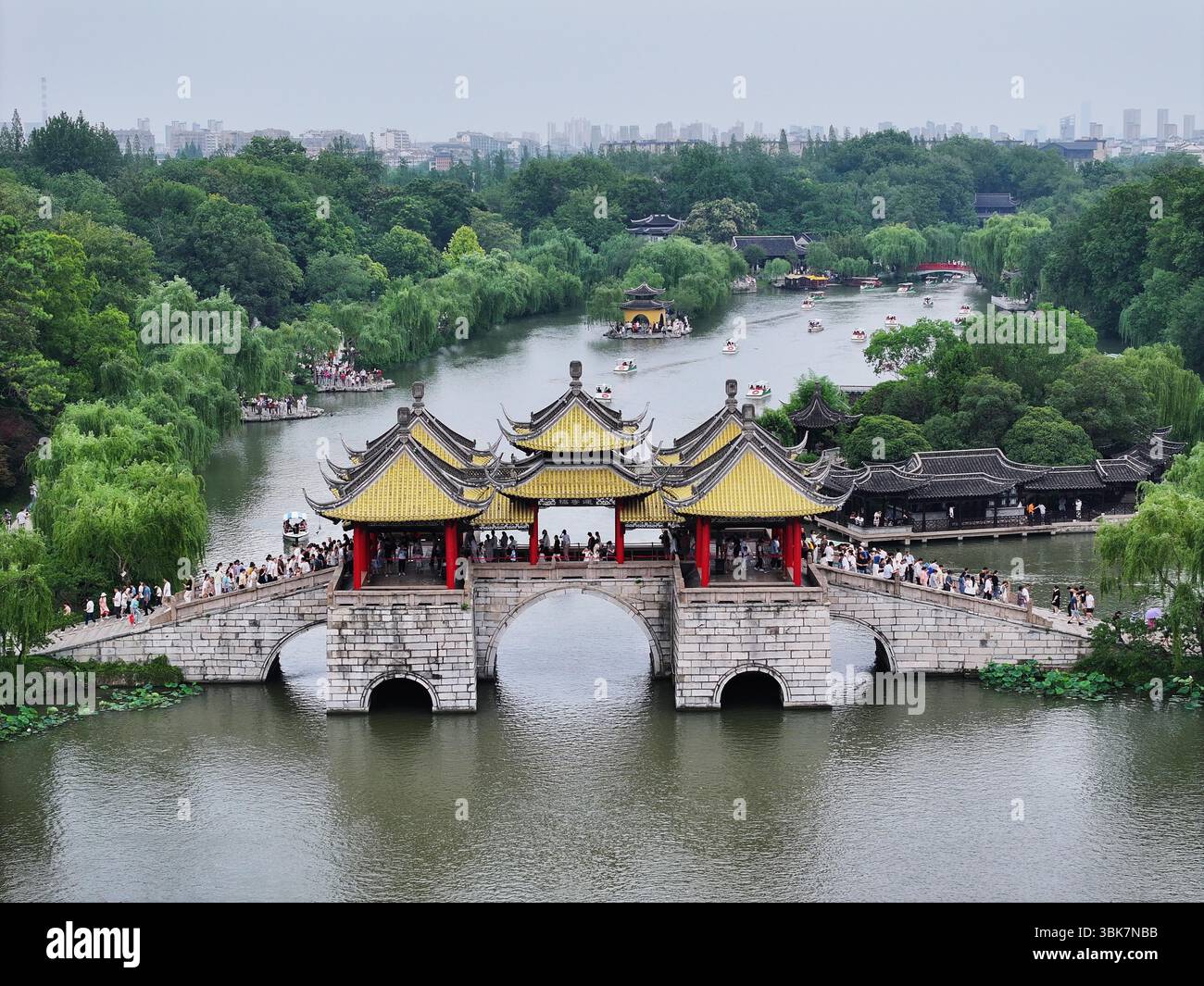 Aerial photo shows tourists visiting the Slender West Lake scenic area ...