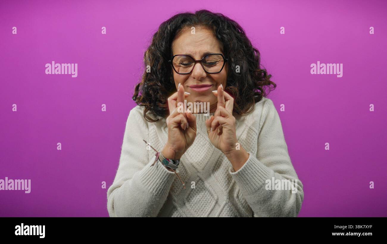 Mature woman curly hair crosses hi-res stock photography and images - Alamy