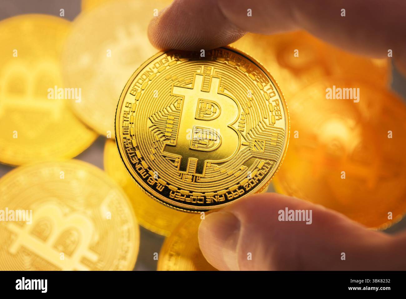 Bitcoin physical coin held in hand Stock Photo - Alamy