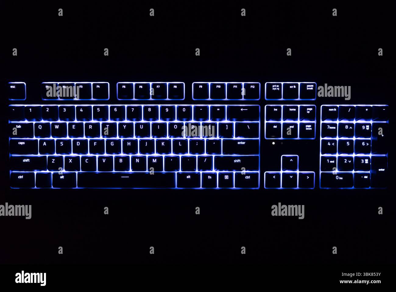 Illuminated keyboard in the dark with RGB lighting closeup Stock Photo ...