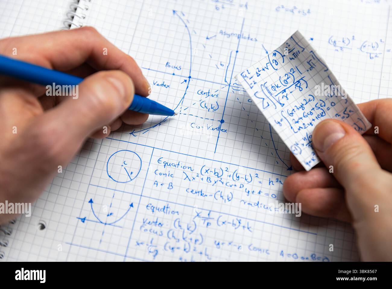 Written Math exercise in notebook closeup Stock Photo