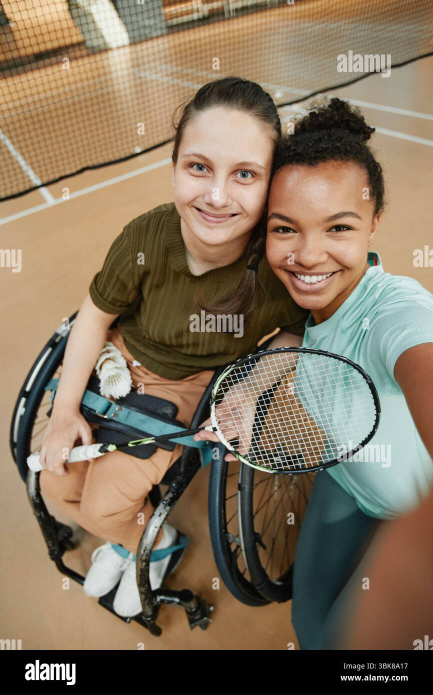 Smiling Woman in Wheelchair Taking Selfie Stock Photo