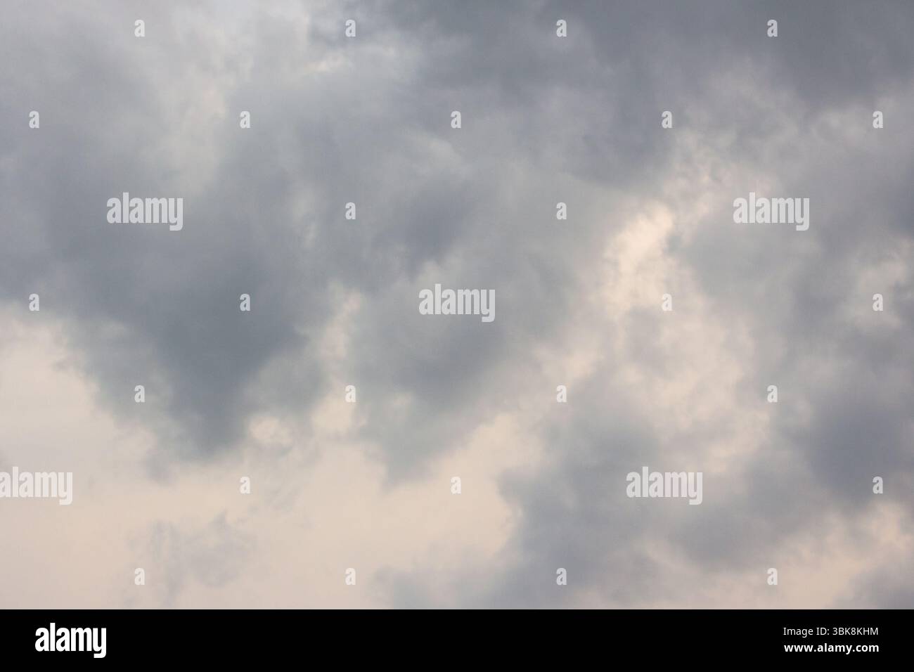 dark storm clouds on the sky. gloomy overcast weather. scenic environment of disaster climate. intense windy front Stock Photo