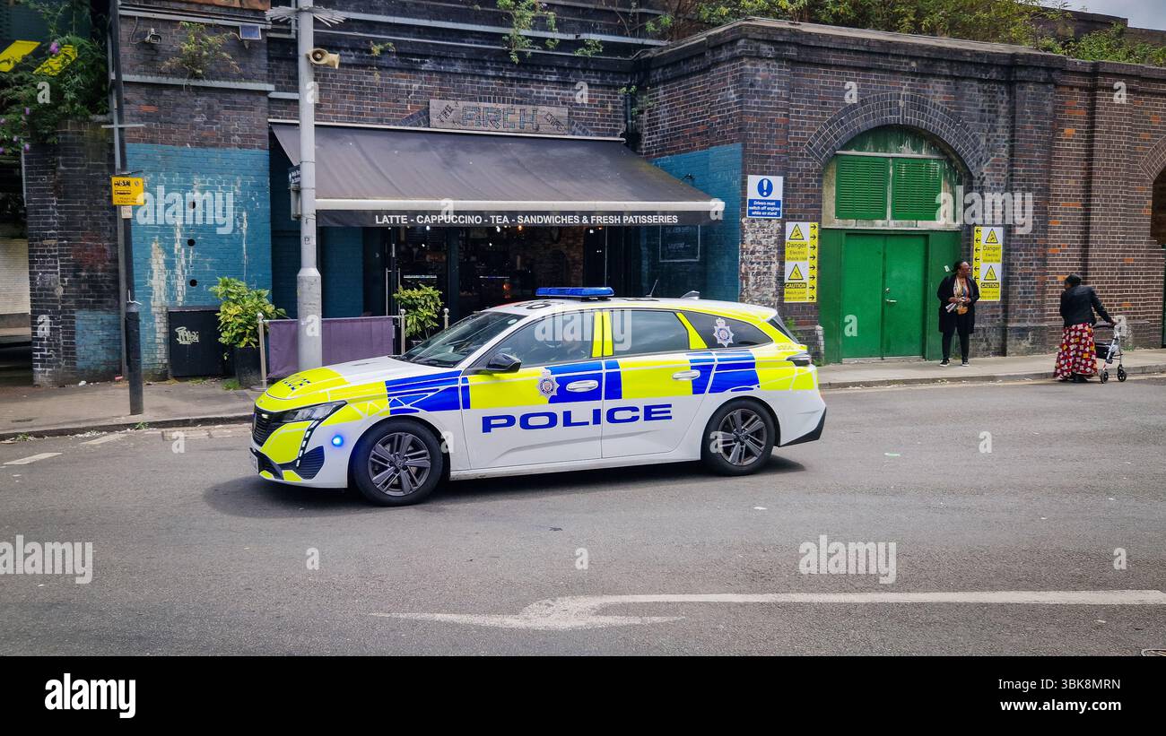 London, UK - July 22, 2024: United Kingdom Metropolitan Police car on a London city street at Finsbury Park. - Smartphone Captured Stock Image
